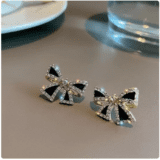 Black bow stud earrings